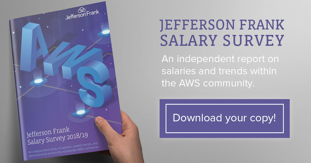 Hand holding a copy of the latest AWS salary survey